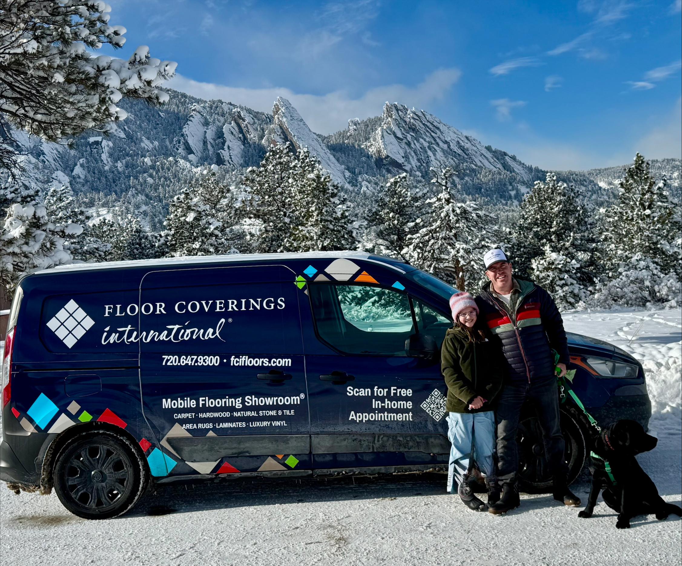 Brian Mullin in front of FCI mobile showroom parked by snow covered mountains