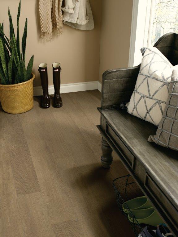 Entryway with a bench, rubber boots and a potted plant on beautiful engineered hardwood flooring
